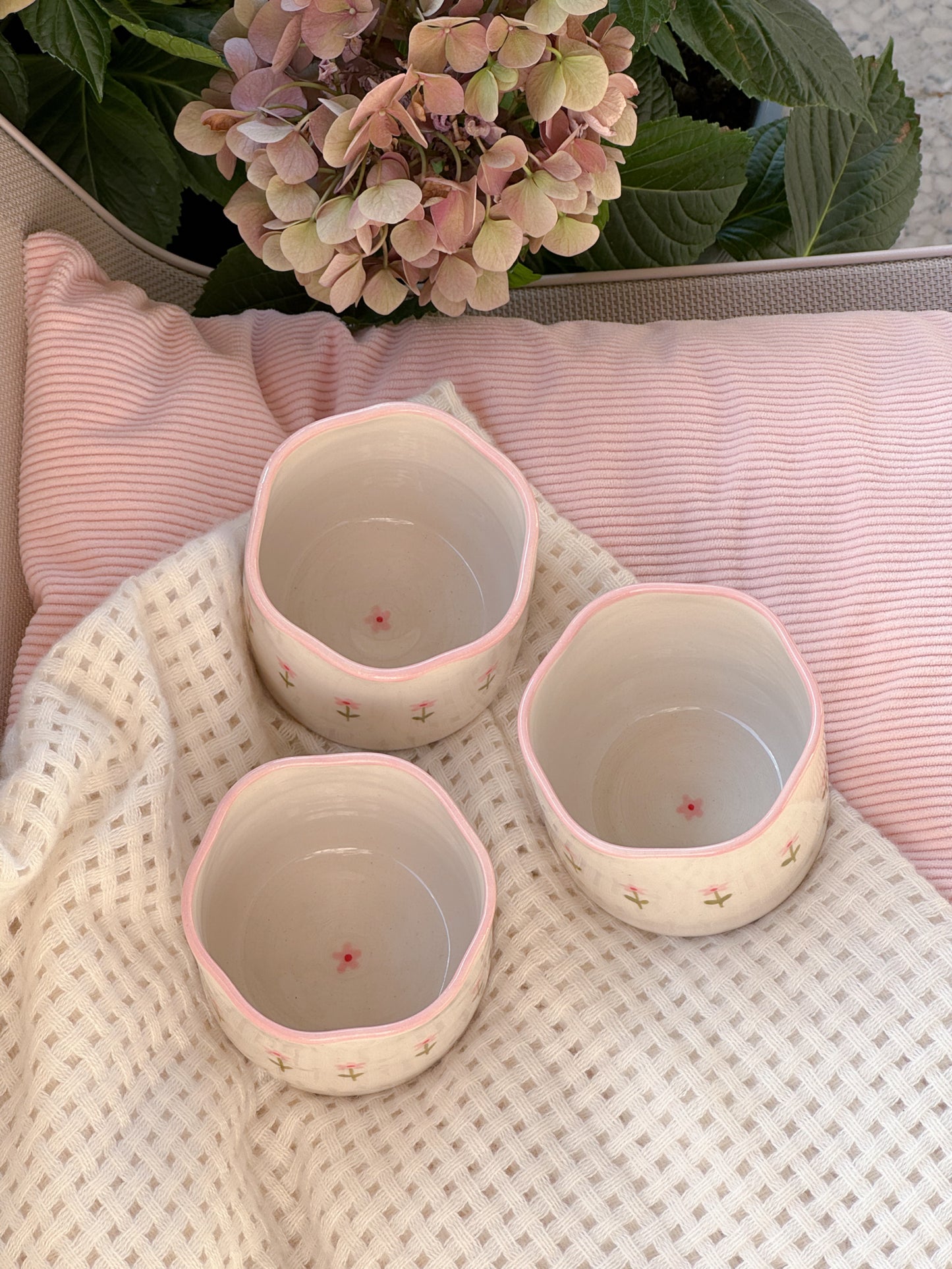 Cup with small pink flowers