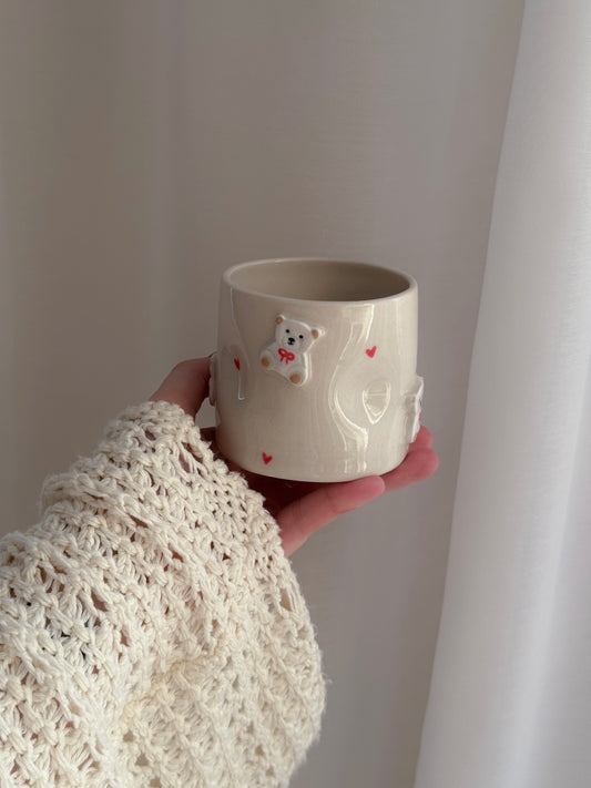 Cup with white teddy bears