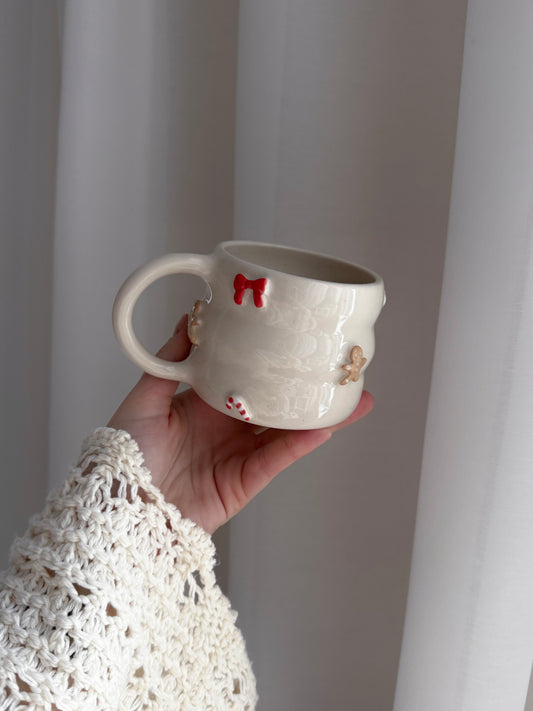 Mug with bows, candy canes and gingerbreads