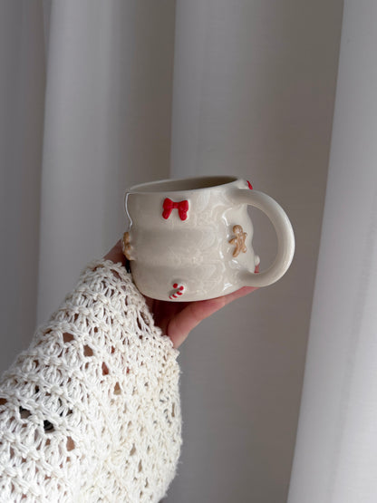 Mug with bows, candy canes and gingerbreads