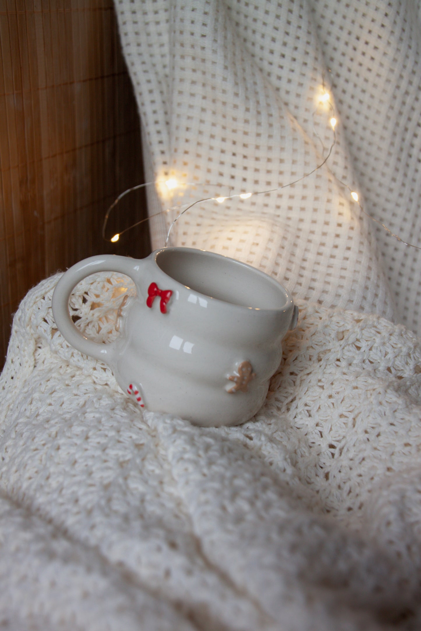 Mug with bows, candy canes and gingerbreads