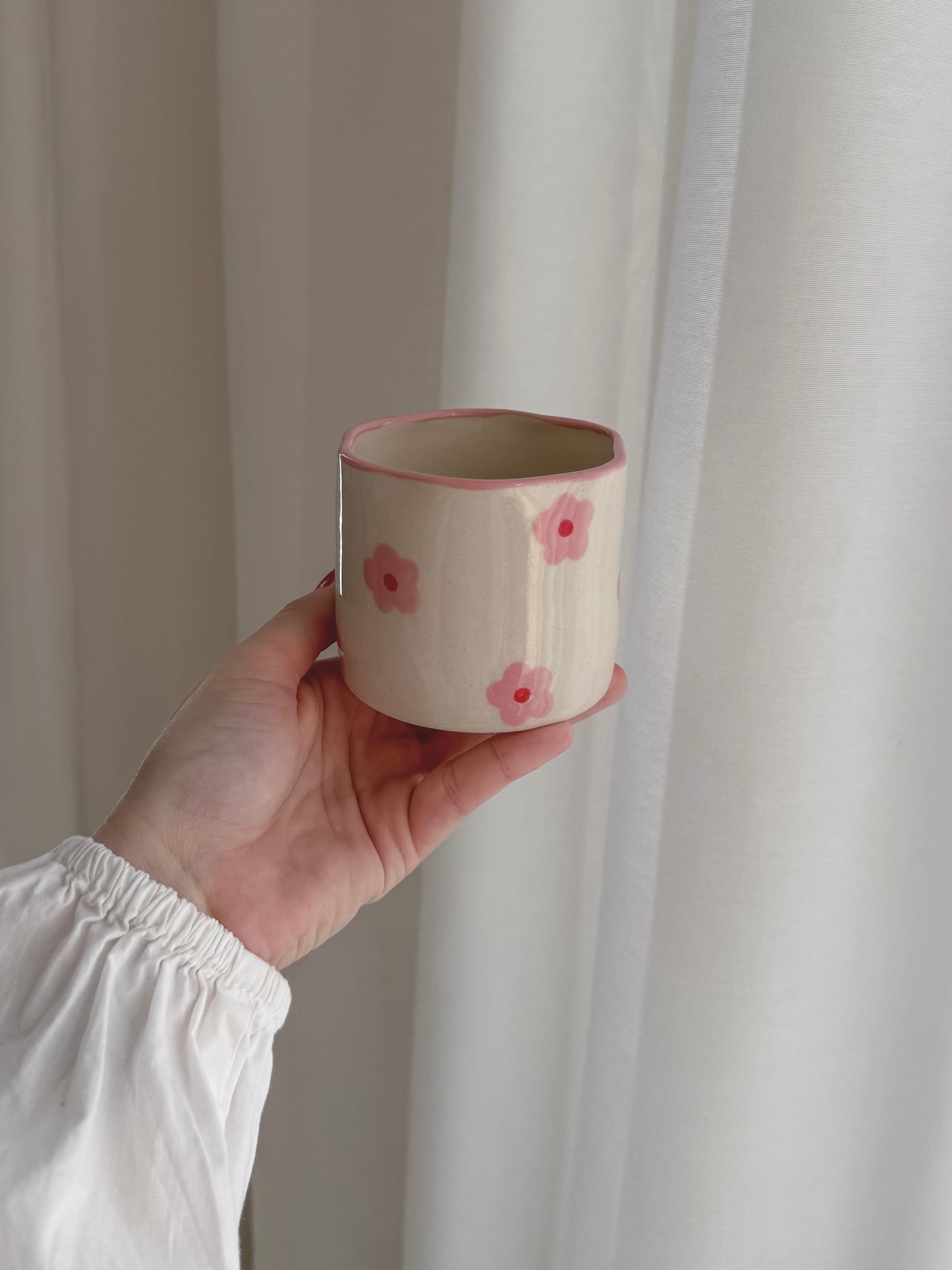 Cup with pink flowers