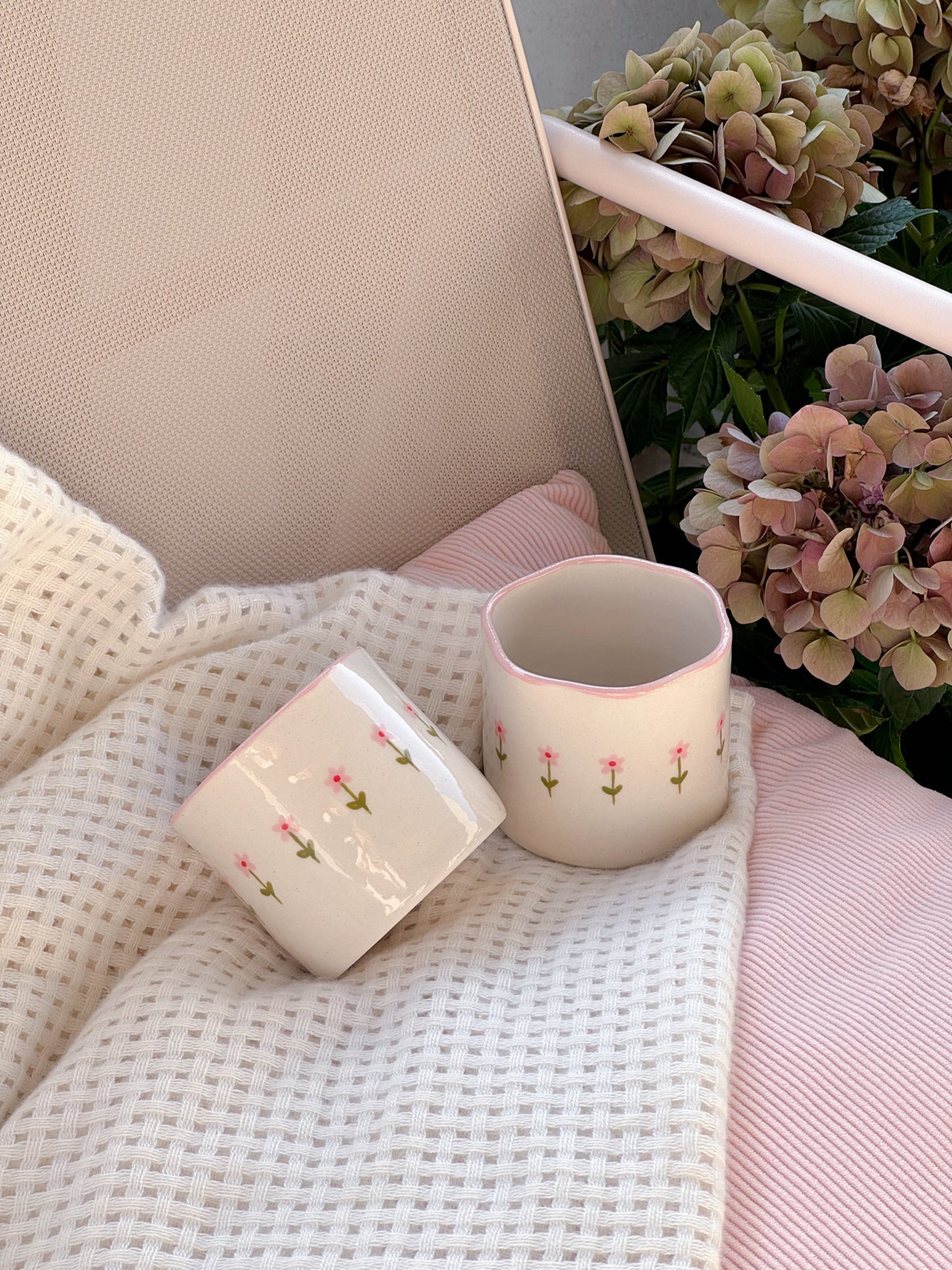 Cup with small pink flowers