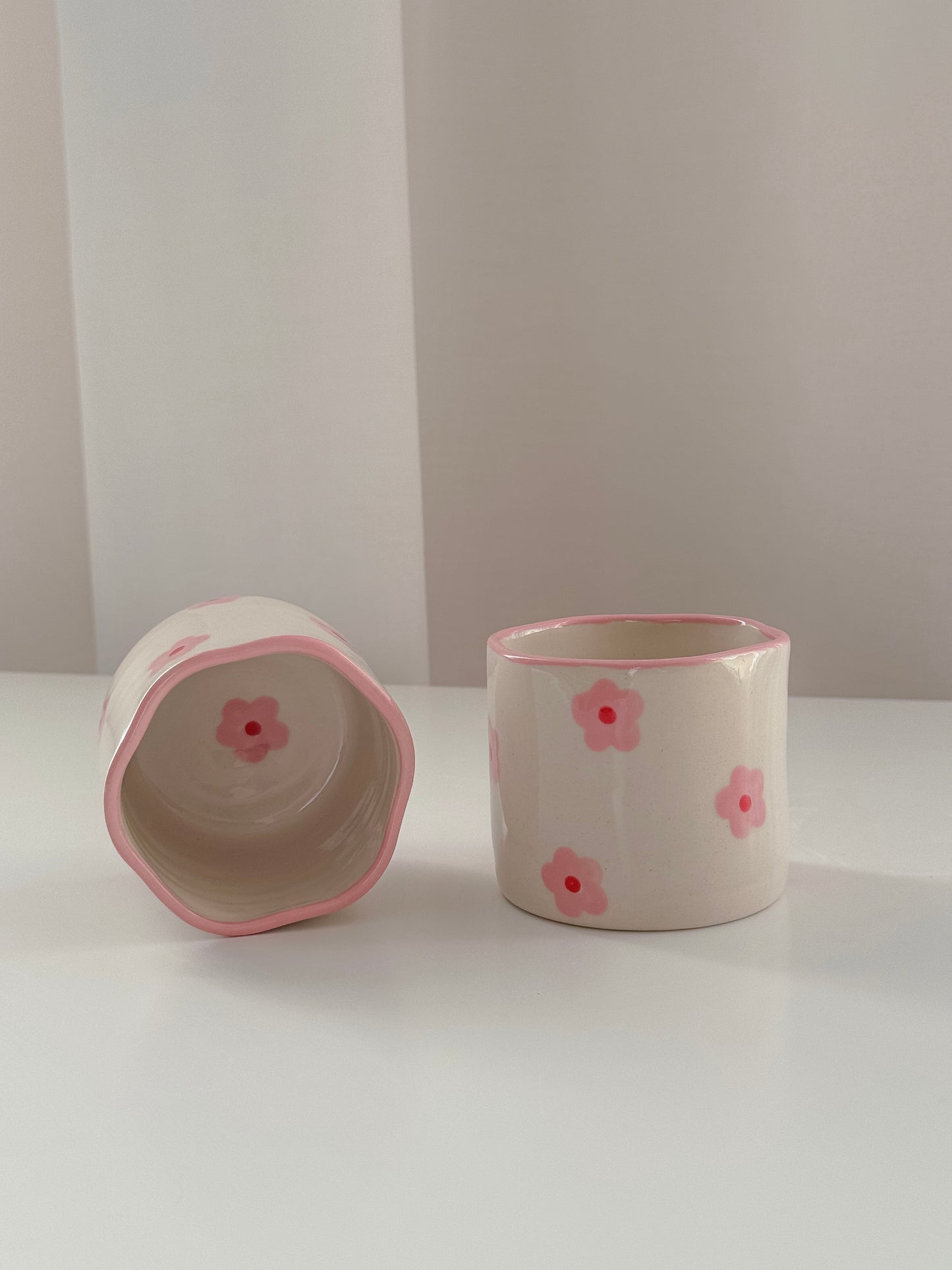 Cup with pink flowers