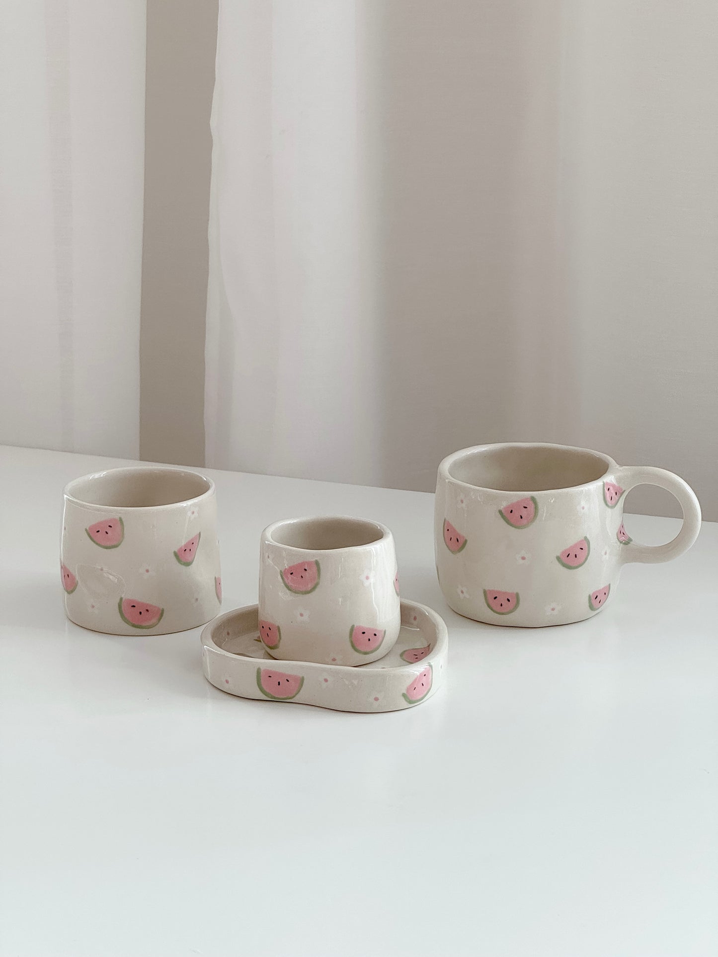 Cup with watermelons and flowers