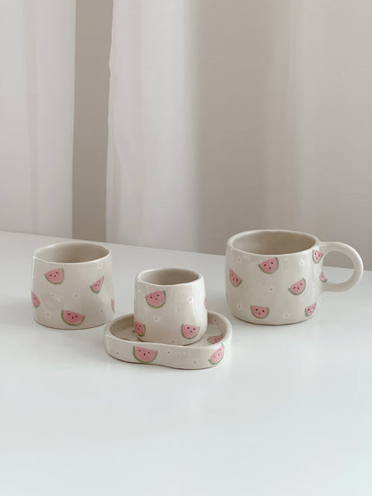 Cup with watermelons and flowers