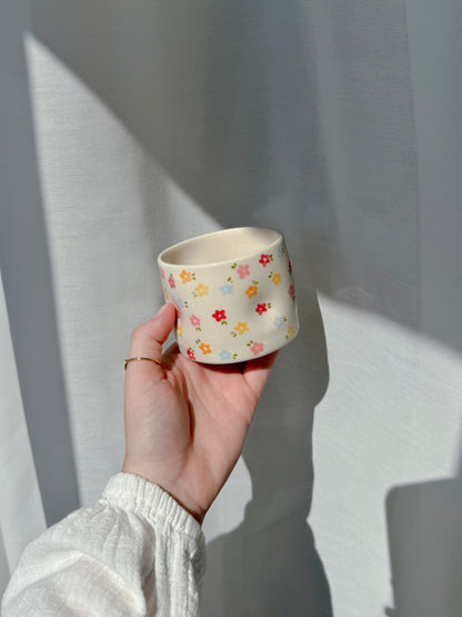 Cup with tiny flowers